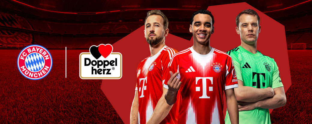 Image features three football players in FC Bayern Munich jerseys, showcasing the team’s colors. The background is a red gradient, and the club logo appears on the left. A "Doppelherz" logo is positioned between the players, indicating a promotional partnership.